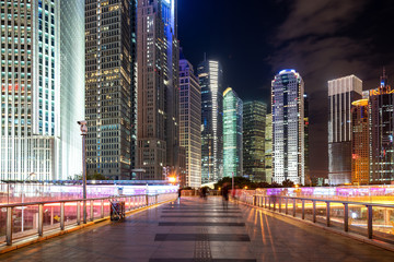 Fototapeta na wymiar At night, footbridges and skyscrapers in Shanghai, China