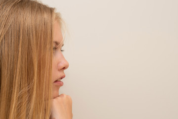 Side view of young teenager girls deep in thoughts. Thinking concept