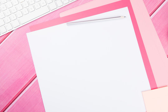 Blank Art Paper With Pencil On Bright Pink Desk 