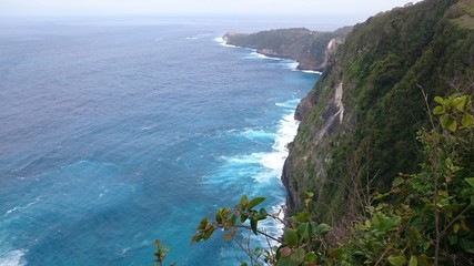 View of the high cliff and the deep blue water