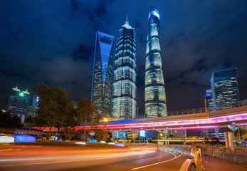under the pedestrian bridge of shanghai cityscape at night, China
