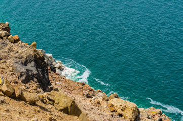 Jordan. Dead Sea. Dead Sea coastline in Jordan. Cliffs descend into emerald water of Dead Sea....