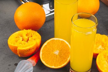 Glass of orange juice and orange slices