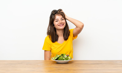 Caucasian girl with salad laughing