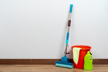 Cleaning tools for house cleaning on wooden floor