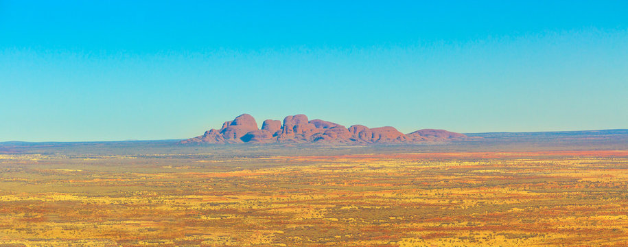 Banner of Mount Olga rock formation in Uluru-Kata Tjuta National Park, Northern Territory, Australia. Aboriginal land in Australian outback Red Centre. Blue sky wih copy space.