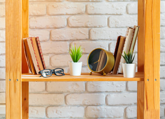 Wooden shelf with home decor on ot