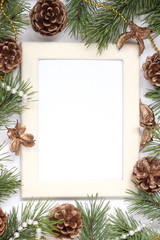 Christmas composition. frame with pine branches, Golden cones and beads