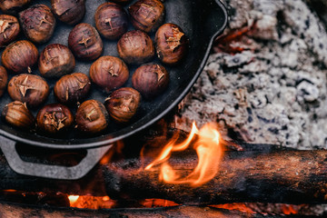 Roasted chestnuts on camping background