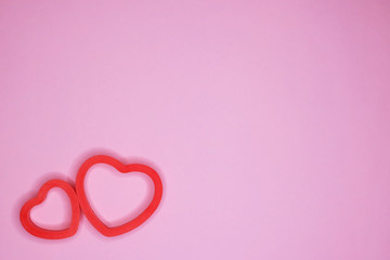 Two hearts on a pink background. Holiday concept. February 14, Valentine's Day, mother's day.