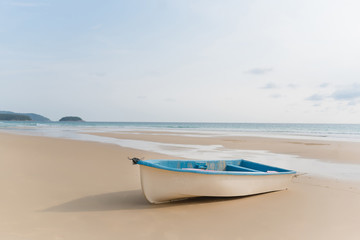 Small boat on a clean beach