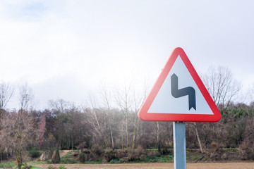 traffic sign of dangerous curves on county road