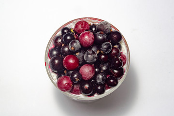 healthy breakfast of chia yogurt seeds and wild berries on a white background fitness food. copy space