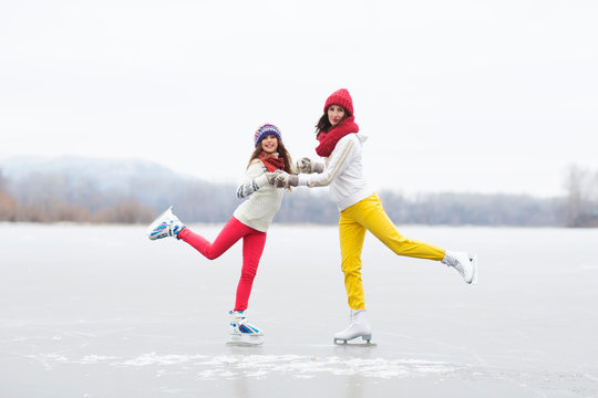 Family Mother With Her Daughter Enjoying In Ice Skating. Outdoor Activities On Weekends. The Joy Of Missing Out.