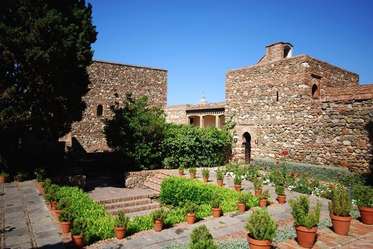 Supplier courtyard and gardens at the Nasrid Palace in Malaga castle, Malaga, Spain.
