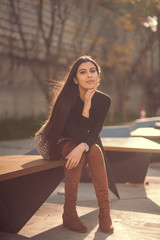 Close up portrait of a girl with long black hair outdoor