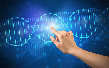 Female hand touching DNA molecule with blue background