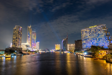Fototapeta na wymiar City view by the river Bright night The beauty of the capital