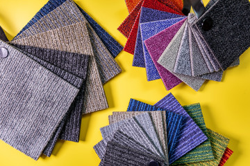 floor carpet samples on yellow background. top view