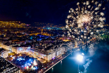 Aerial view of Aristotelous square in Thessaloniki during New Year celebrations with fantastic multi-colored fireworks