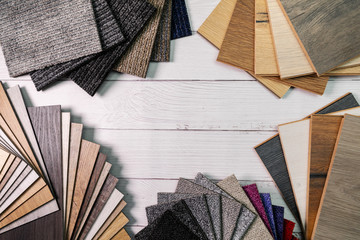 flooring and furniture materials - floor carpet and wooden laminate samples with copy space - obrazy, fototapety, plakaty