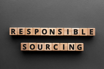 Responsible sourcing - word from wooden blocks with letters, responsible sourcing concept, gray...