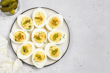 Holiday Easter one-bire snack, dill pickle deviled eggs.Top view, space for text.