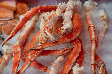 Crab legs sea food on ice background
