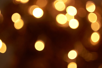 beautiful yellow bokeh lights background on dark