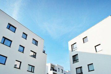 Modern apartment buildings on a sunny day with a blue sky. Facade of a modern apartment building