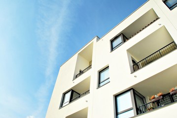 Modern apartment buildings on a sunny day with a blue sky. Facade of a modern apartment building