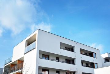 Modern apartment buildings on a sunny day with a blue sky. Facade of a modern apartment building