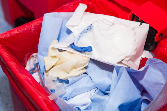 Biological risk waste disposed of in the red trash bag at a operating room in a hospital