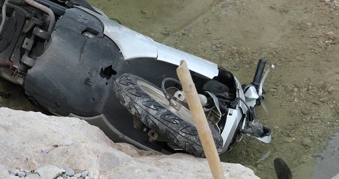 Abandoned Stolen Motorbike (Scooter) Dumped In River. Close Up View - DCi 4K Resolution