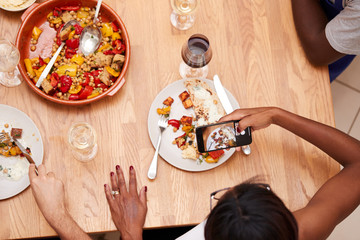 Close Up Of Woman Taking Photo Of Vegetarian Meal For Social Media In Cookery Class