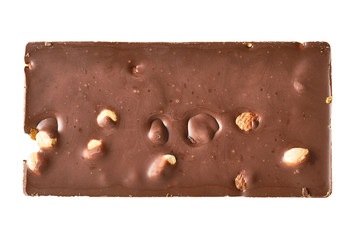Whole rectangular chocolate bar with peanut and raisin isolated on white background