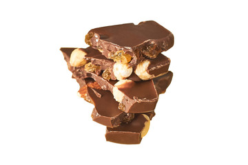 Heap of pieces of rectangular chocolate bar with peanut and raisin isolated on white background