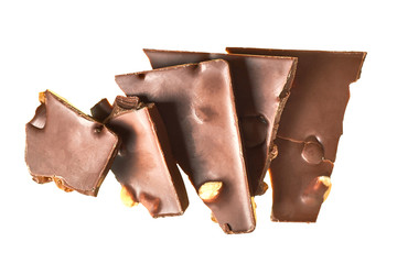 Row of pieces of rectangular chocolate bar with peanut and raisin isolated on white background