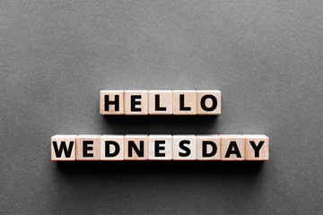 Hello wednesday - words from wooden blocks with letters, hello wednesday concept, top view gray background © SecondSide