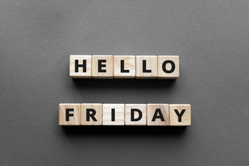 Hello friday - words from wooden blocks with letters, hello friday concept, top view gray background