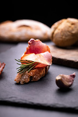 Appetizing sandwich made of freshly baked, crunchy bread with Krakowska dried sausage. Traditional cold cuts.