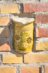 Halfway immured ceramic jar