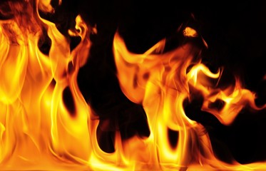 Bright orange flame on black background