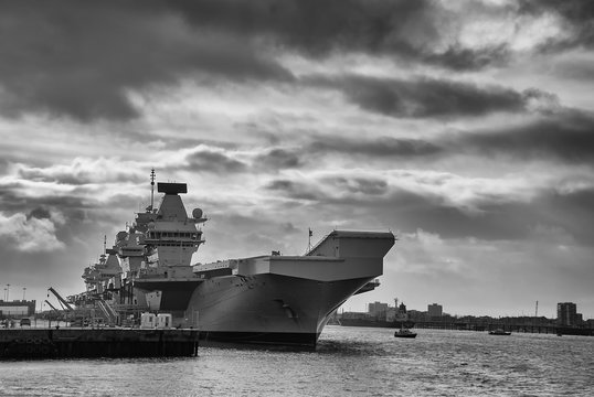 The Royal Navy aircraft carrier HMS Queen Elizabeth (RO8) docked in Portsmouth, UK
