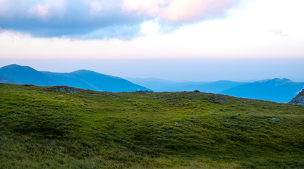 Fototapeta premium Sunrise on Fagaras high mountain ridge. Romanian mountain landscape with high peaks over 2200m
