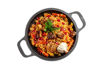 Uzbek pilaf with lamb in an Uzbek plate with in an iron pan. isolated image