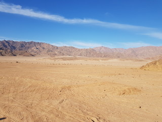 Fototapeta na wymiar Landscape with mountains in Egypt. Rocky hills. Blue sky