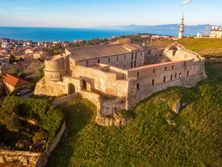 Fototapeta na wymiar Aerial view of the Norman Swabian castle, Vibo Valentia, Calabria, Italy. Overview of the city seen from the sky, houses and rooftops