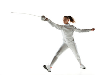 Champion. Teen girl in fencing costume with sword in hand isolated on white background. Young...