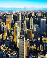 Fototapeta na wymiar Aerial panoramic view. on Midtown district of Manhattan in New York. Hudson river is on the background. Metropolitan City skyline, USA. American architecture building. Panorama of Metropolis NYC